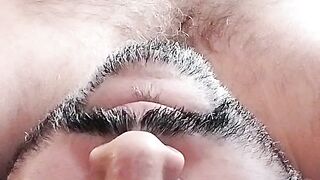 In bed massaging my brown cock